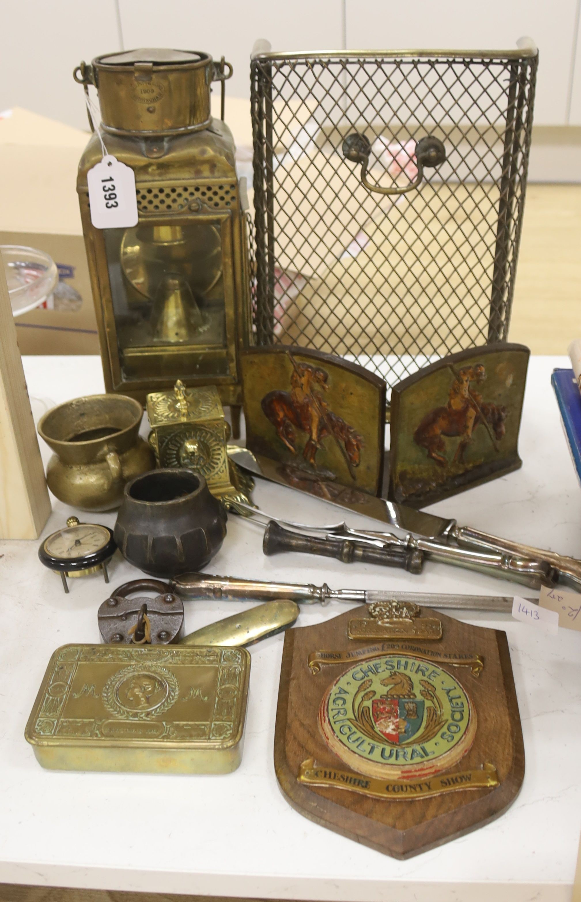 A Victorian brass spit guard, a brass railway lamp, a brass inkwell, a Queen Mary Christmas 1914 cigarette tin, a padlock, etc